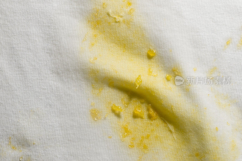 Stain of tangerine on white cloth